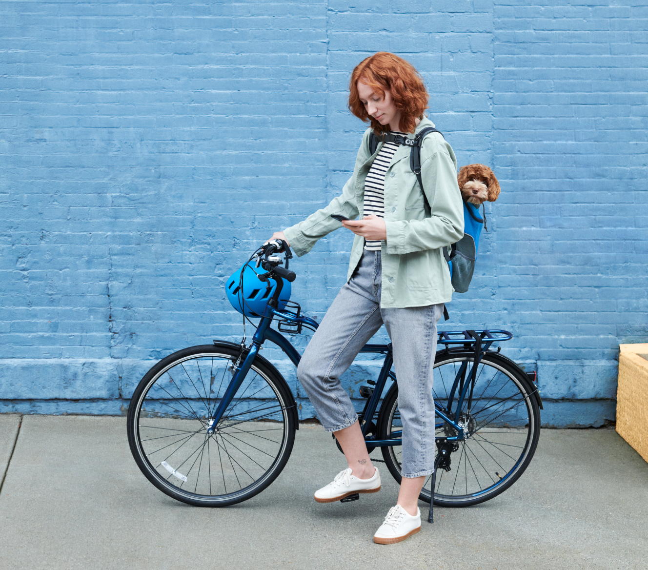 Woman on a bike checking her ADT app on her phone