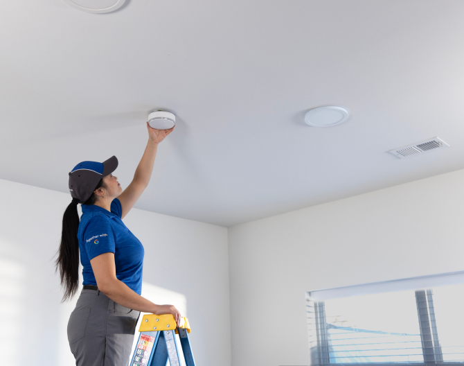 ADT technician installs ADT Smoke and Carbon Monoxide Detector