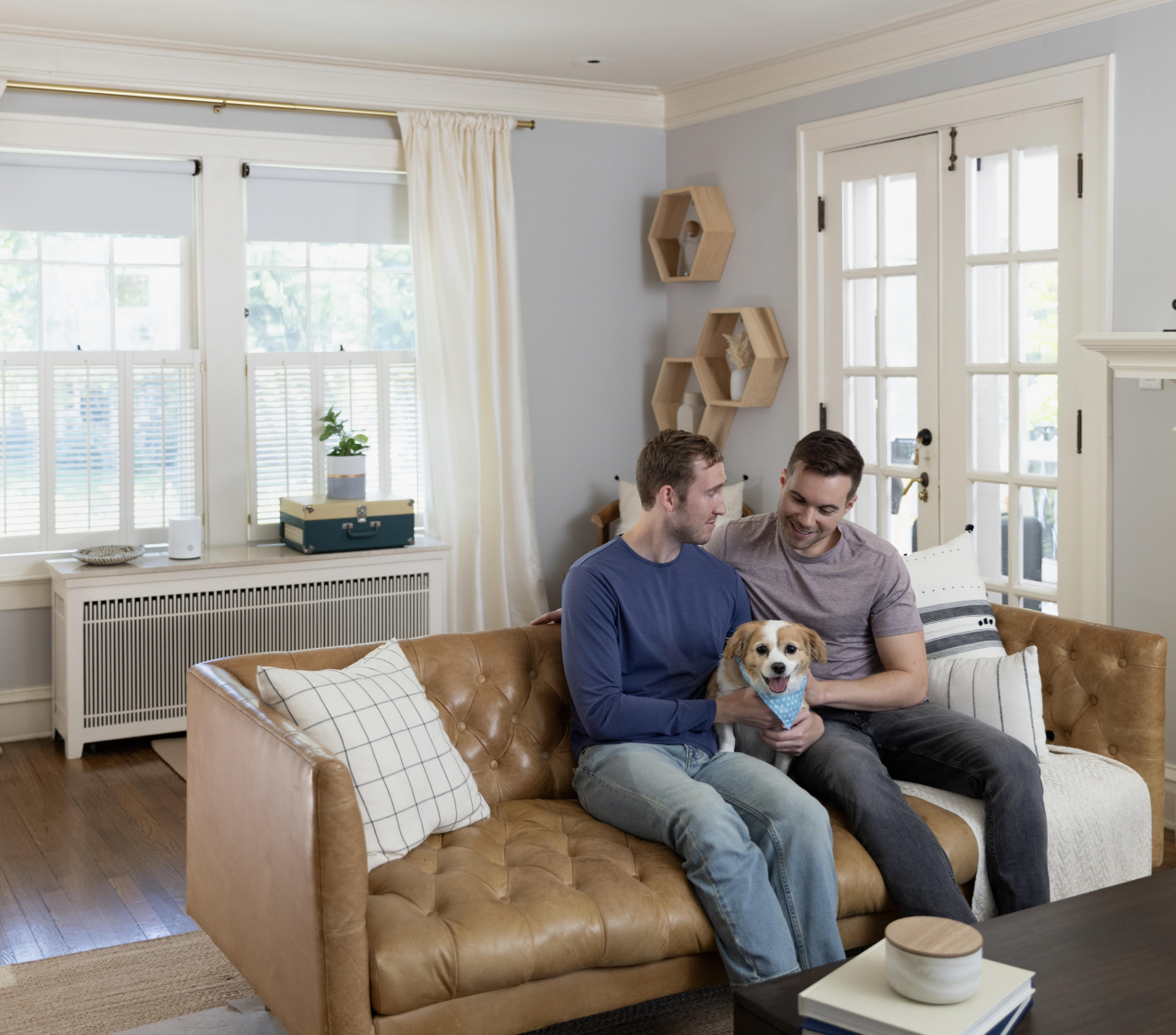 Couple with dog on couch 