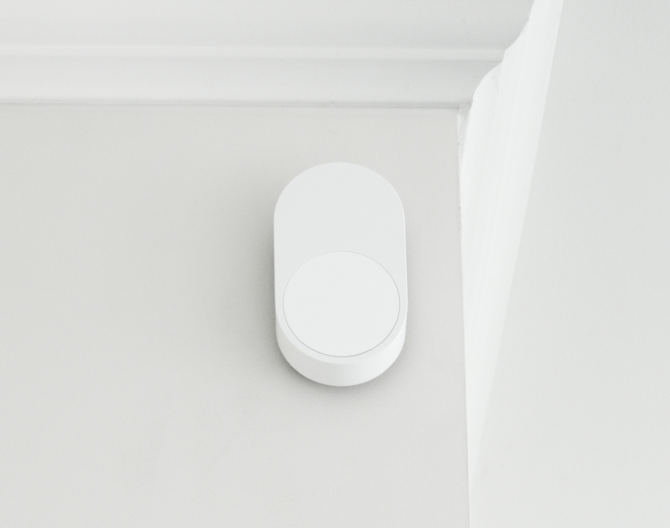 ADT Motion Sensor on a wall by a ceiling 